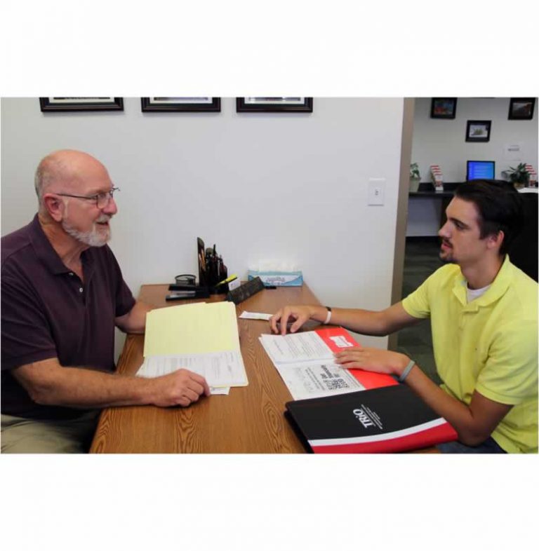 College advisor and student discussing educational opportunities at Pensacola State College.