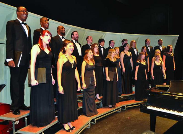 Choral and jazz students sing during a free college concert at Pensacola State College.