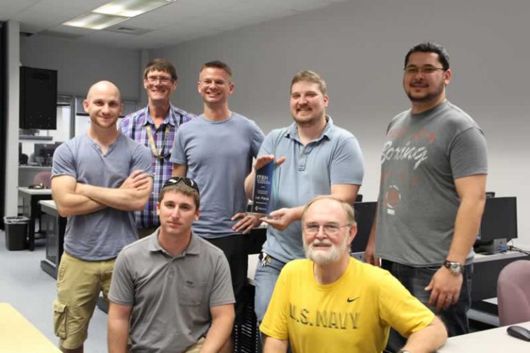 Cybersecurity team celebrating victory at ITEN summit, Pensacola State College.