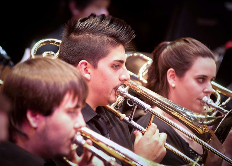 High school and college students perform jazz and wind ensemble music at Pensacola State College.