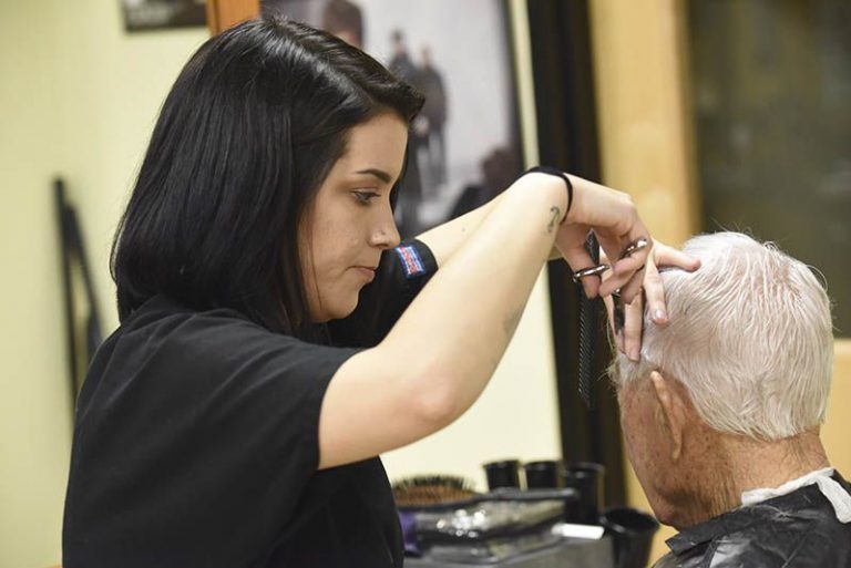 Highly skilled cosmetology students from Pensacola State College perform haircuts at the Barbering C.