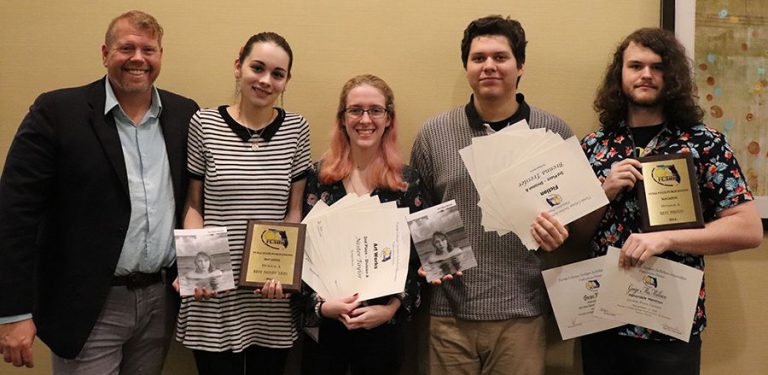 Highly accessible image of Pensacola State students celebrating their awards at the FCS Publication.