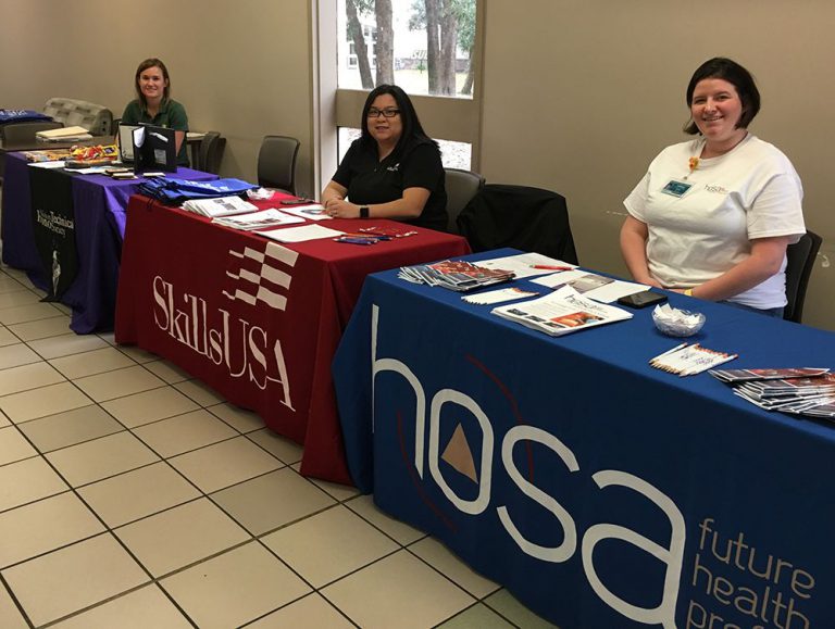 HOSA and SkillsUSA student representatives at college fair.