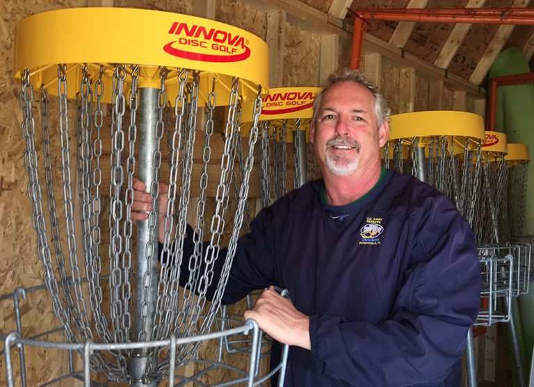 High-quality disc golf basket at Pensacola State College campus.