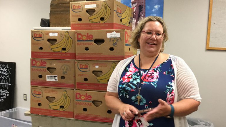 Food pantry restocking at Pensacola State College following AFC Food Drive donation.