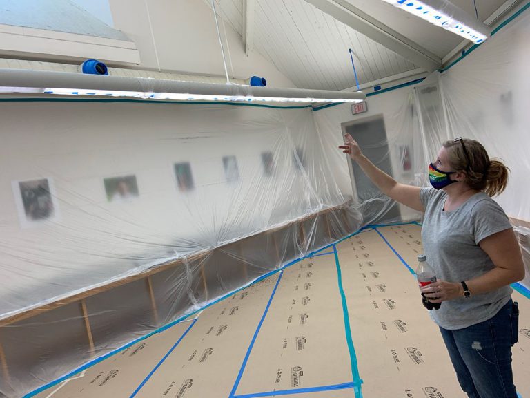 Accessible image of a visual arts instructor preparing for hurricane disruption.