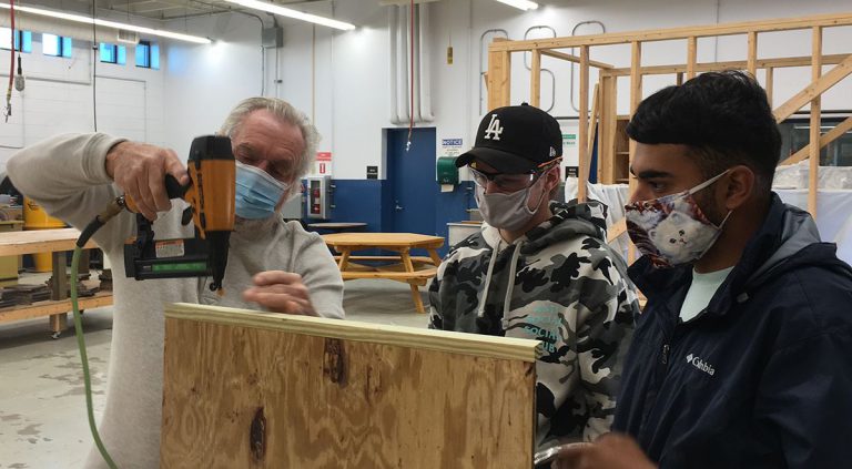 Carpentry students at Pensacola State College working on a woodworking project.