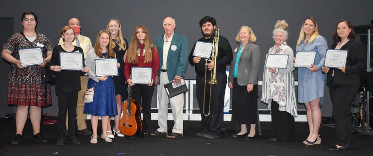 Group of students receiving scholarships from Cantonment Rotary Club at Pensacola State College.