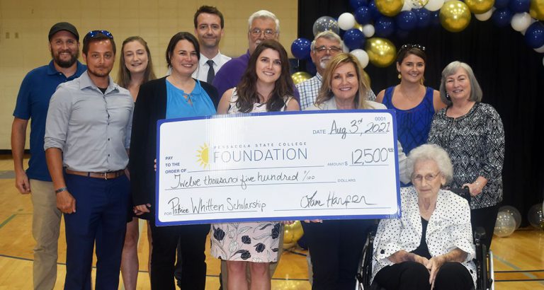 Scholarship donation ceremony at Pensacola State College Scholarship donation ceremony at Pensacola State College honoring Patrice Whitten's contributions.