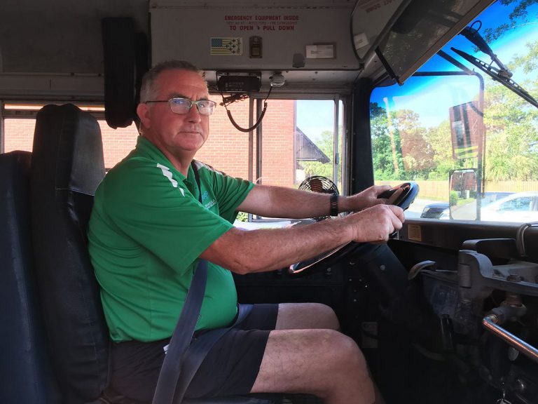 School bus driver at Pensacola State College, symbolizing leadership transition in higher education. School bus driver at Pensacola State College, symbolizing leadership transition in higher education.