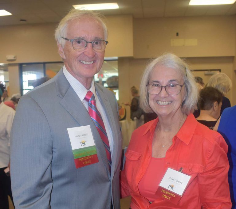 Dr. Troy Tippett at Pensacola State College establishing endowed teaching chair in STEM. Dr. Troy Tippett and a female colleague at Pensacola State College during a formal event.