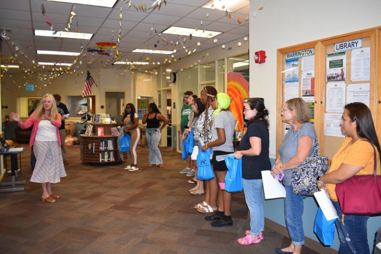 Students, prospective students gather at Warrington campus library during Pirate Open House.