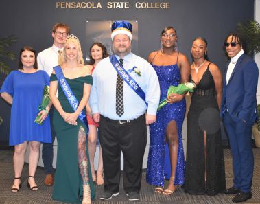 Celebrating homecoming at Pensacola State College with students and faculty in formal attire.