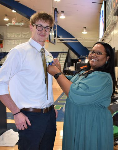 Happy student and graduate at Pensacola State College Homecoming celebration.