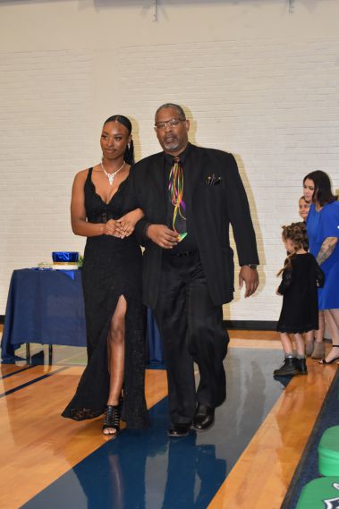Elegant student and faculty dance during Homecoming event at Pensacola State College.