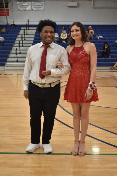 Diverse students attending homecoming event at Pensacola State College basketball court.