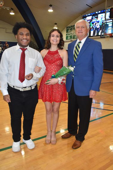 Smiling students and faculty during homecoming event at Pensacola State College gymnasium.