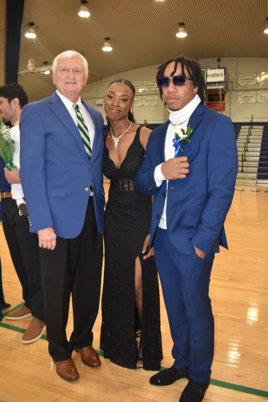 Elegant students and faculty at college homecoming event.