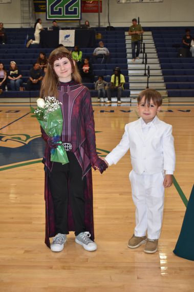 Beautiful students celebrating graduation at Pensacola State College gymnasium.