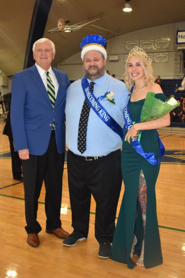 Happy Homecoming event with students and faculty celebrating college spirit.