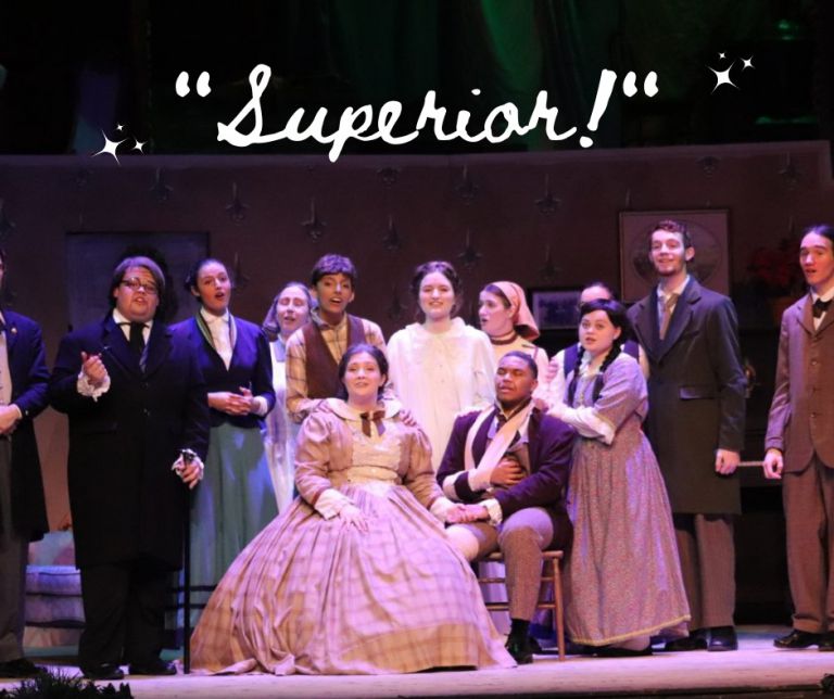 Ensemble of students in period costumes portraying characters from the classic play.