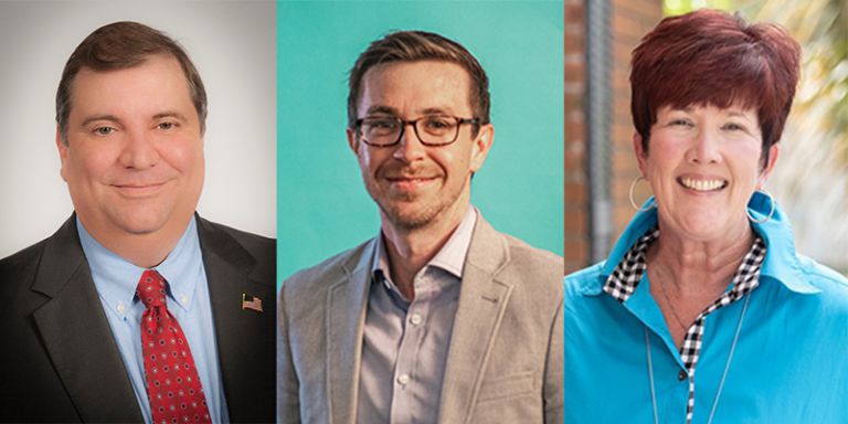 Three professionals attending nonprofit volunteer and intern management workshop at Pensacola State.