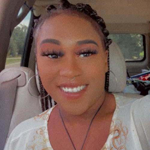 Empowered student Ajuauna Pryor at Pensacola State College campus Smiling young woman Ajuauna Pryor, a student at Pensacola State College, showcasing diversity and ac.