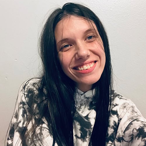 Kaitlynn Marie Simpson at Pensacola State College campus Kaitlynn Marie Simpson smiling outdoors at Pensacola State College, showcasing student success and c.