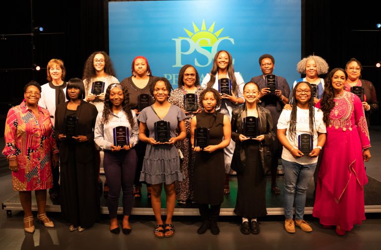 Scholarship award ceremony at Pensacola State College celebrating student achievements Pensacola State College students receiving Garrett T. Wiggins endowed scholarships at a formal event.