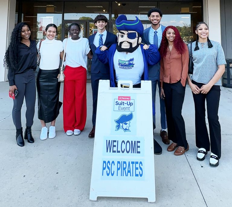 Pirates at PSC promote professional preparedness during CTE Month event. Students gather with PSC mascot for career and technical education awareness.