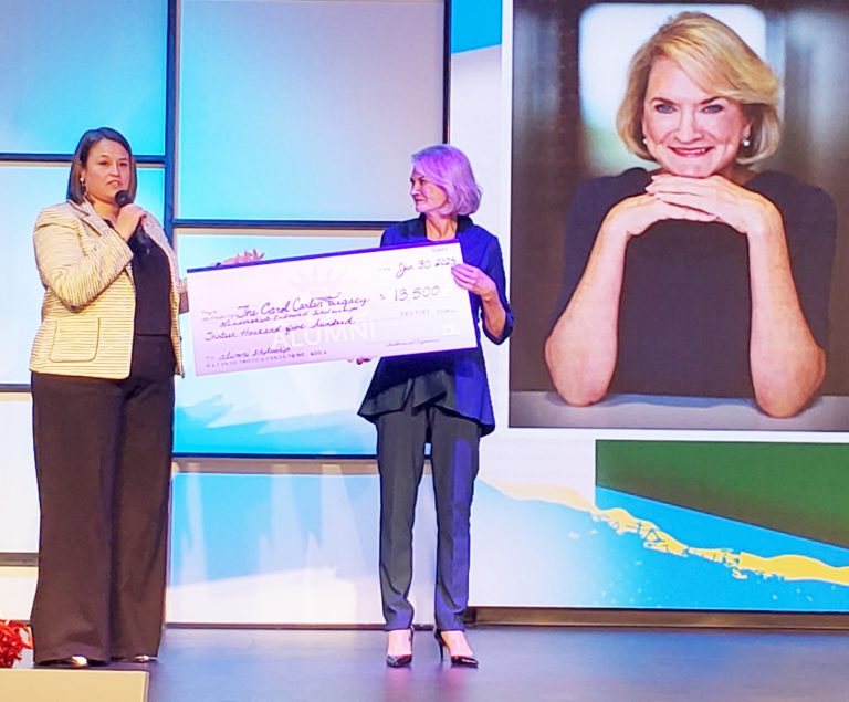 Scholarship donation presentation for PSC alumni and community leaders.