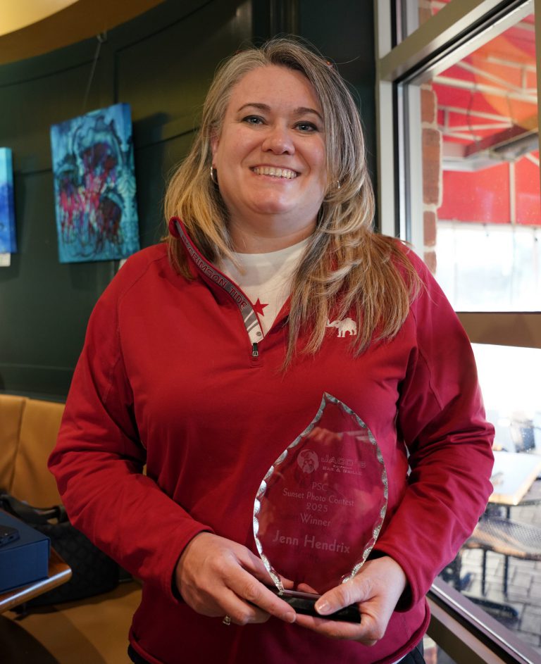 Student photographer with award at Jaco’s PSC Sunset Photography Contest.