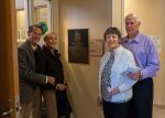 Harry Wilder, Jill Wilder, Martha Wilder, and Chris Elmore unveil a plaque.