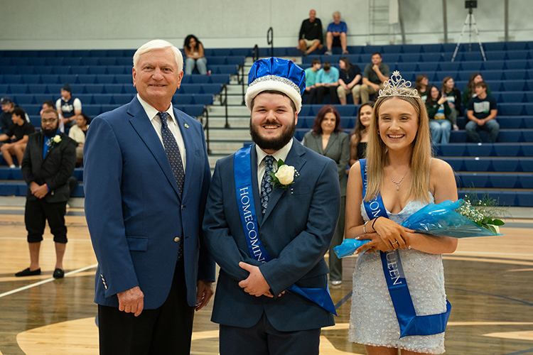 PSC President with the 2025 Homecoming King and Queen, Gabriel Nees and Makayla Jolean.