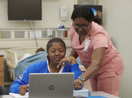 PSC Student and teacher engaged in learning