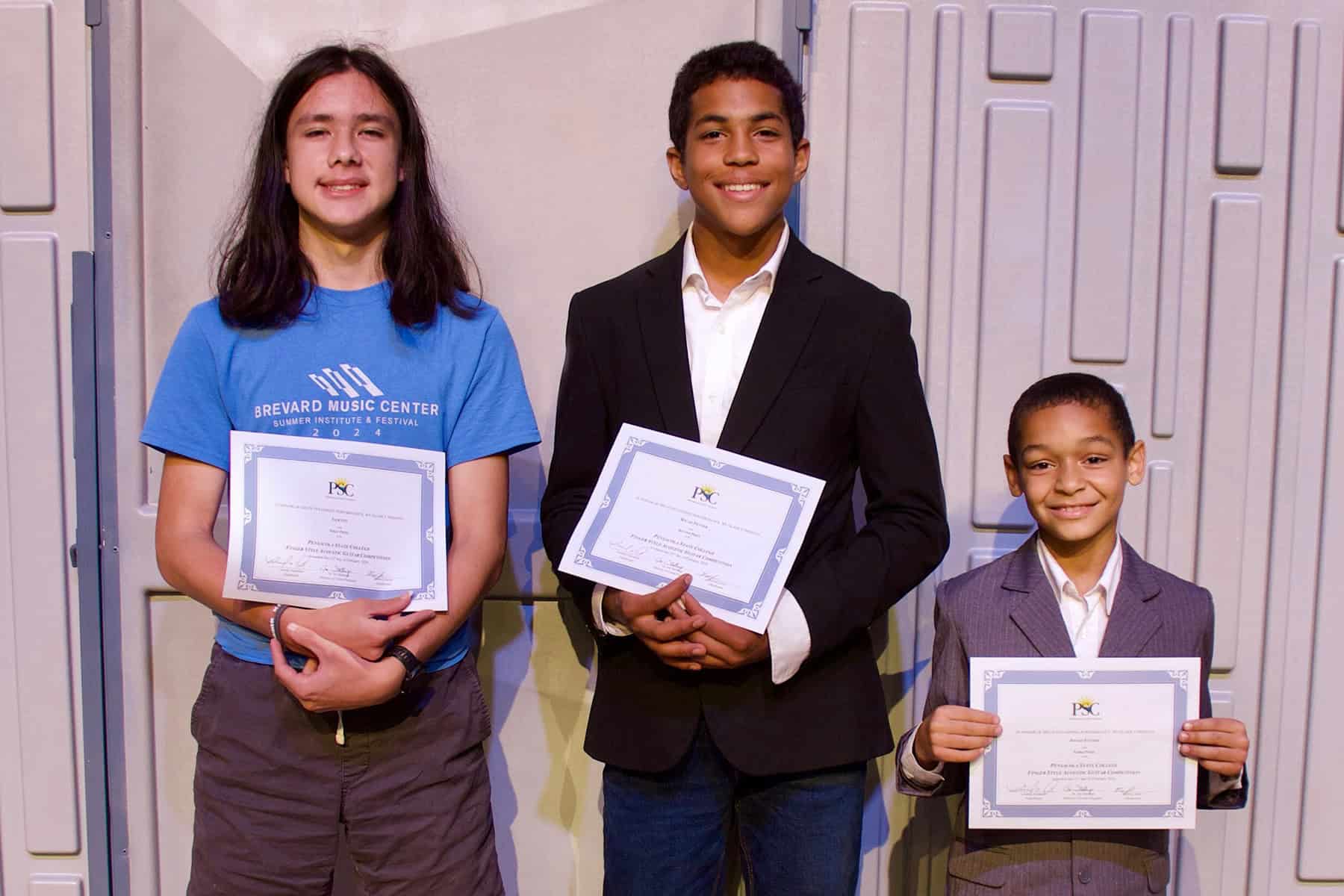 Music students with certificates at Pensacola State College Spring Recital.