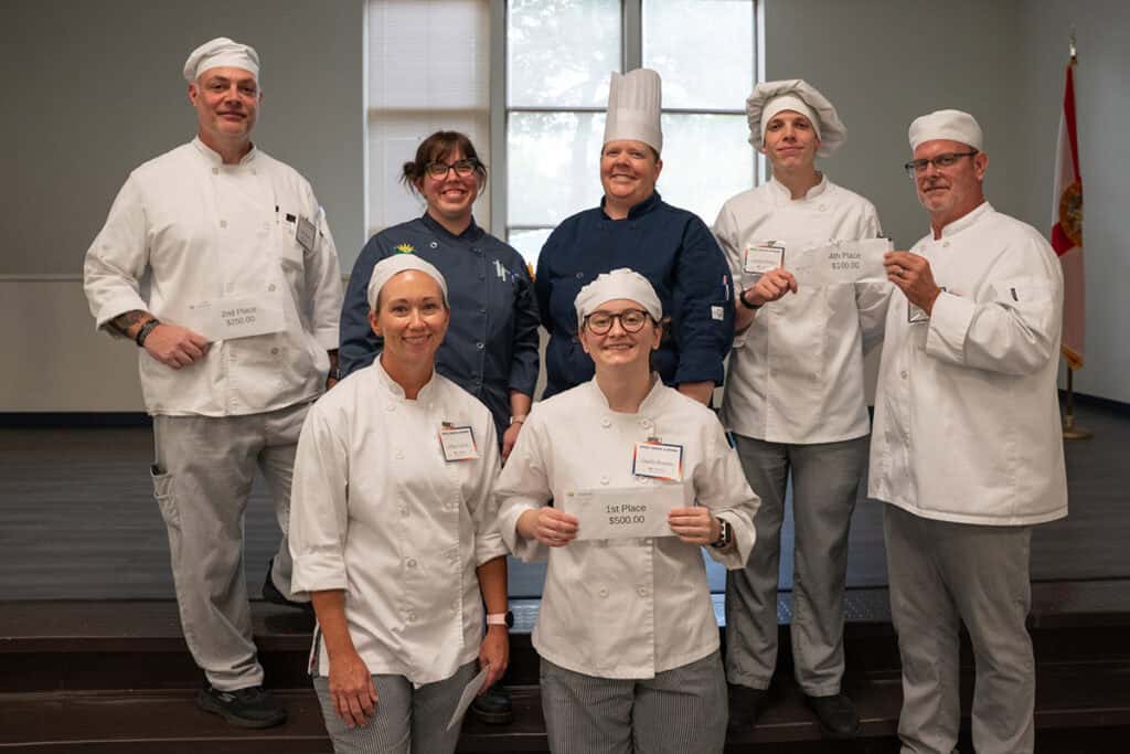 Winners of the Graze, Grapes & Grains student-chef competition, in front: Allison Carlock (third place) and Hayden Brojanac (first place); back row from left: Robert Schultz (second place), Chef Tatyana Hulsey and Chef Kristin Bonnell (PSC faculty), Nathan Pletcher and Bradley McCollum (tied for fourth place).