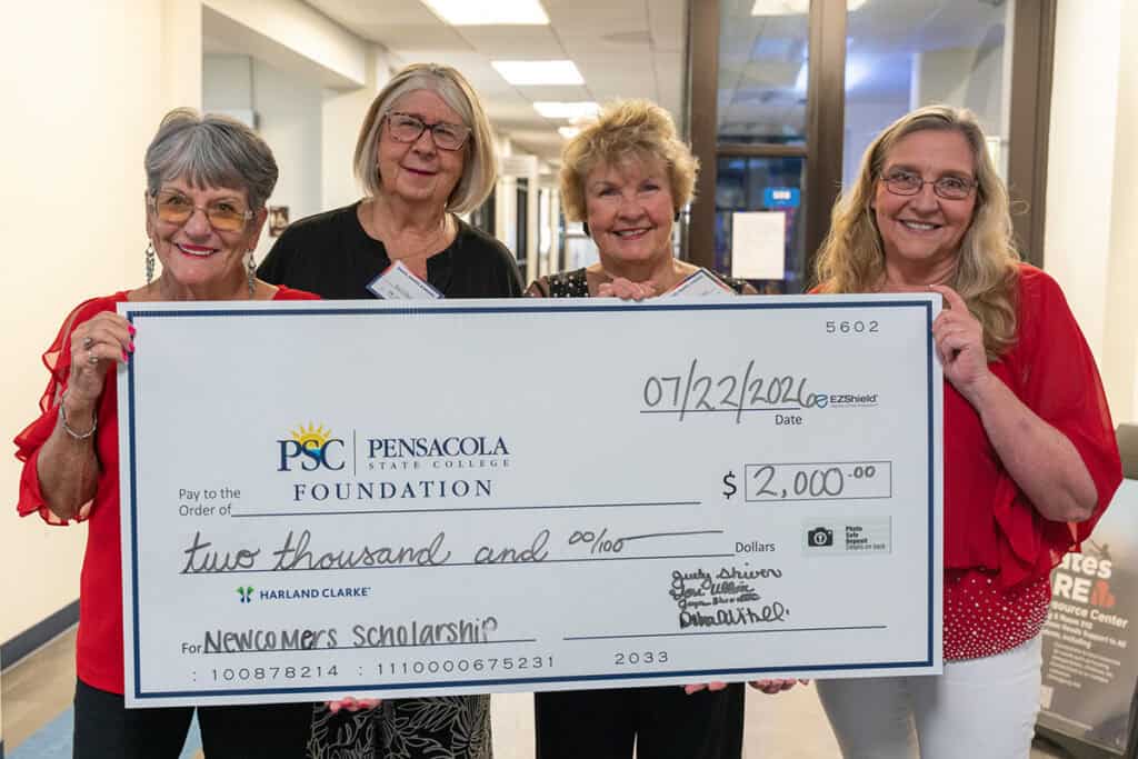 The Newcomers Club of Greater Pensacola traditionally presents their annual donation to the PSC Foundation during the &ldquo;Graze, Grains & Grapes&rdquo; event. From left: Jayne Showalter, Teri Ullon, Judy Shiver and Debbie Vitulli. 
