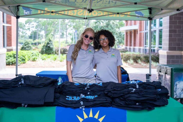 Student ambassadors Caroline Mitchem and Nicole McWilson, greet new students during Pirate Path new student orientation sessions at Pensacola State College.
