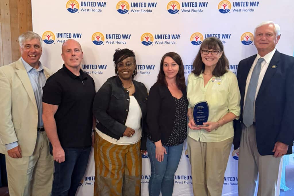 From Pensacola State College: Grover Robinson, Jamie Russell, Juanita Scott, Shannon Crawford, Debbie Douma and PSC President Ed Meadows.