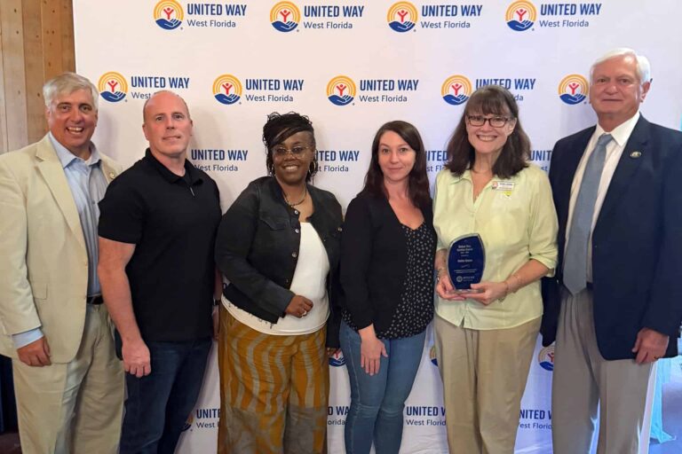 From Pensacola State College: Grover Robinson, Jamie Russell, Juanita Scott, Shannon Crawford, Debbie Douma and PSC President Ed Meadows.