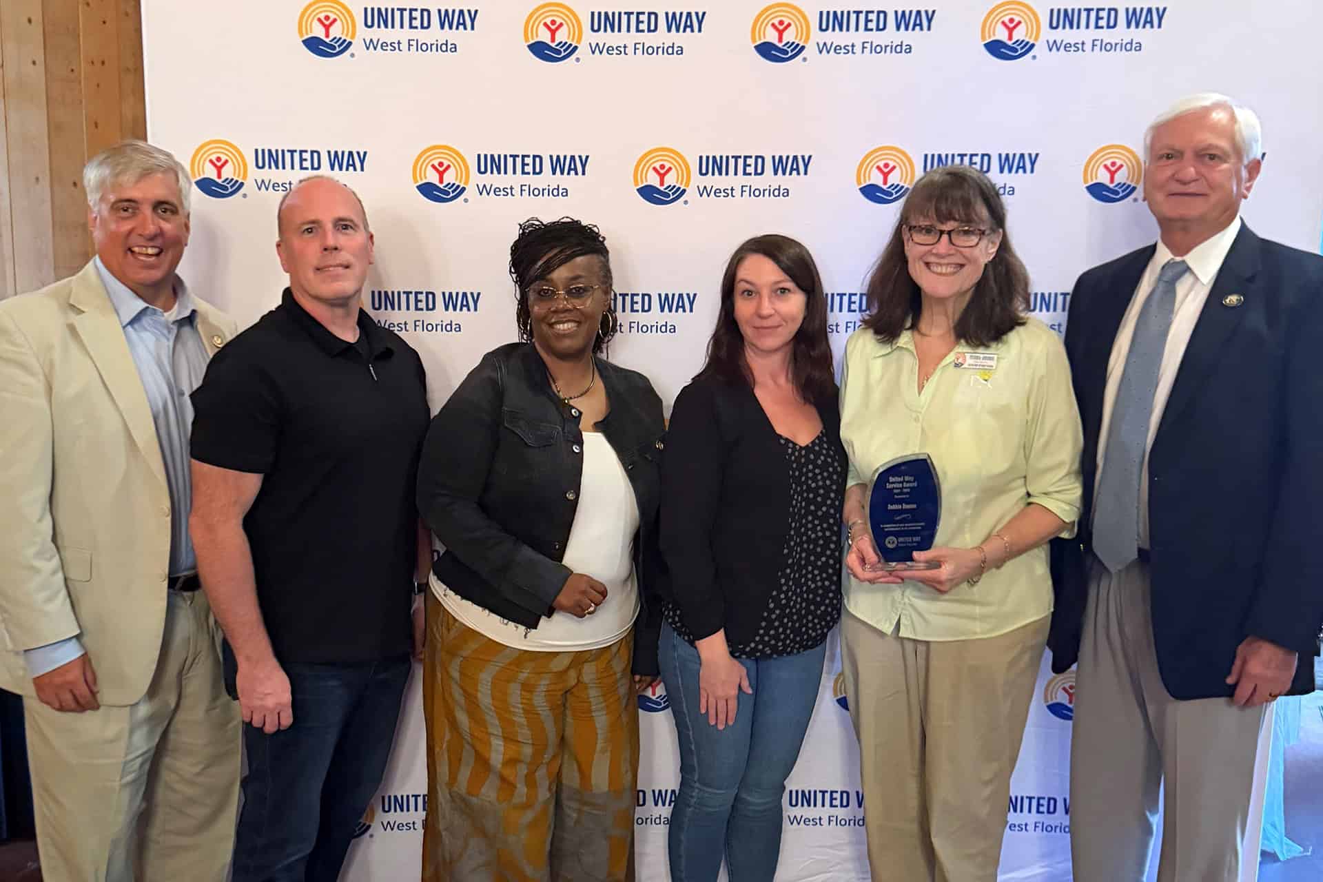 From Pensacola State College: Grover Robinson, Jamie Russell, Juanita Scott, Shannon Crawford, Debbie Douma and PSC President Ed Meadows.