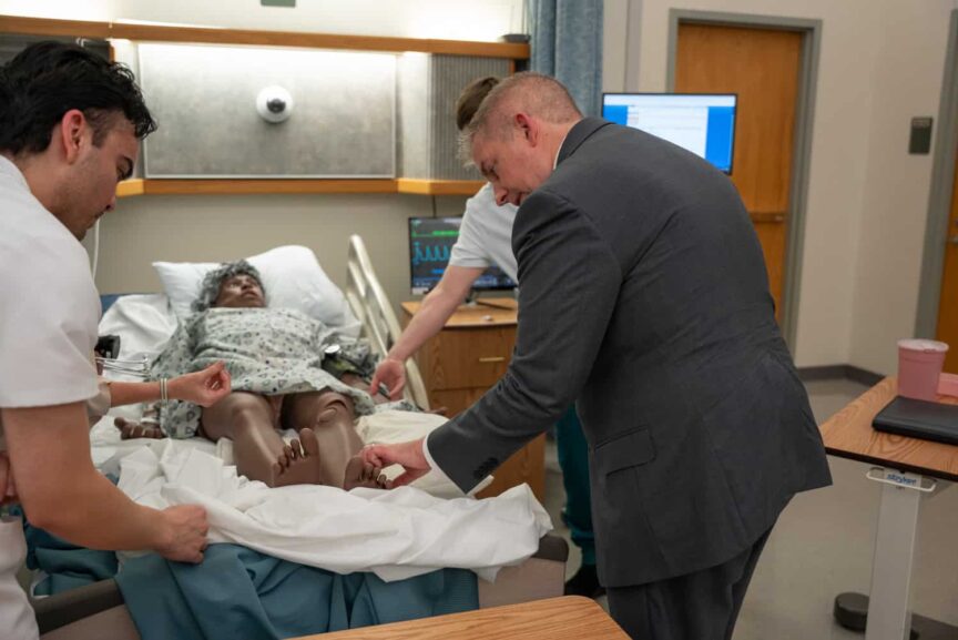 J. Kelly touring healthcare program departments at Pensacola State College.