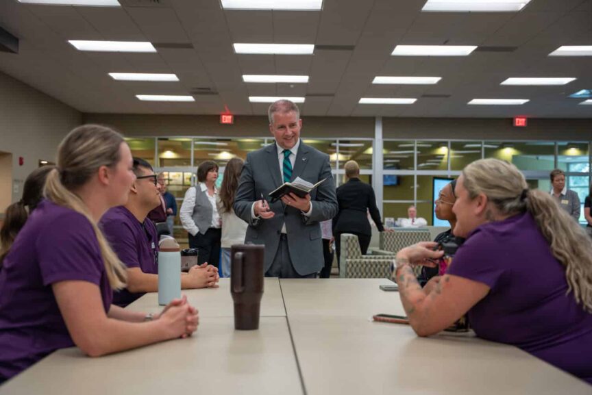 J. Kelly greeting faculty, staff and students at Pensacola State College.