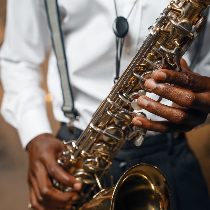 Decorative image of a man playing saxophone.