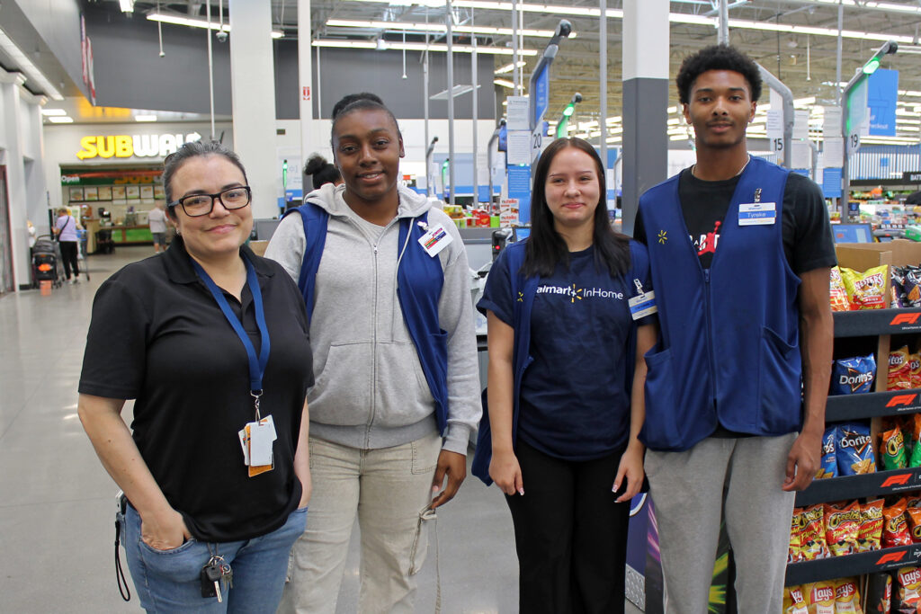 Walmart associates Maria Solis, Adazsha Lee, Cheyanne Kramer and Tyrike Williams gathered and helped load supplies for PSC Pirates CARE hurricane recovery kits.